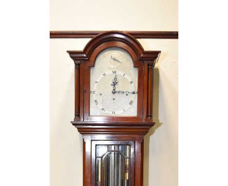 An Edwardian mahogany musical longcase clockThe case with astragal glazed trunk, the arched 10.5in silvered dial with Roman c