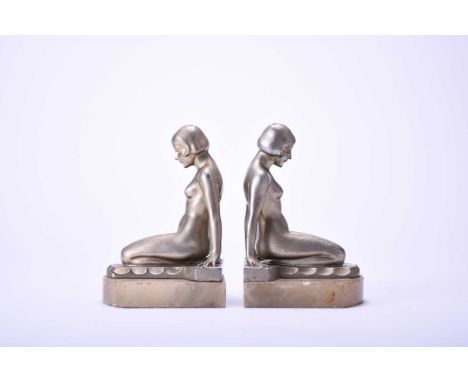 A pair of Art Deco gilt spelter figural bookends, modelled as kneeling nude maidens set on alabaster bases.13.5cm high (2)Con