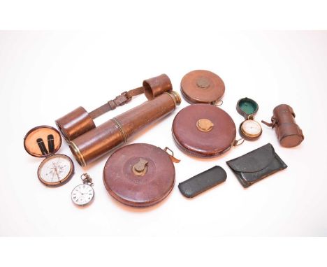 An assembled group of tape measures, a telescope and other instrumentsIncluding two 100ft leather-bound tape measures, a simi