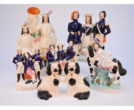 A collection of Staffordshire portrait figures, 19th century, including a large 'Robin Hood' spill vase, 38.5cm high; a Crime