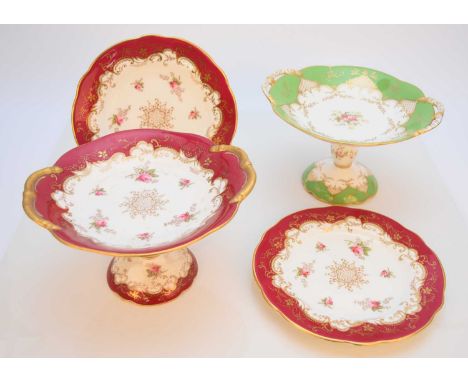 A Coalport dessert service, early 20th century, claret borders with printed and hand-coloured with roses, comprising a pair o