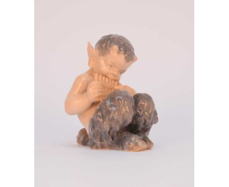 A Royal Copenhagen faun model, model 1736, modelled seated, playing a panpipe, date mark indistinct but possibly 1954, printe