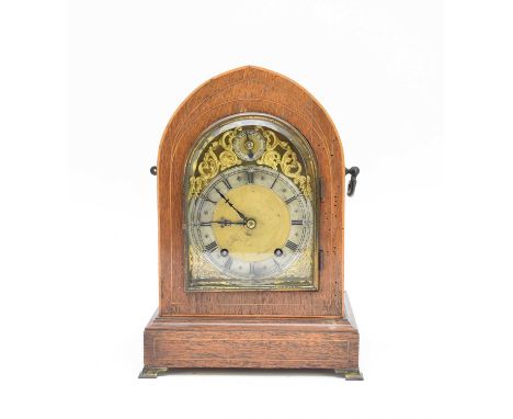 An early 20th century lancet top inlaid rosewood bracket clock, the brass dial with silvered Roman chapter ring, the eight-da