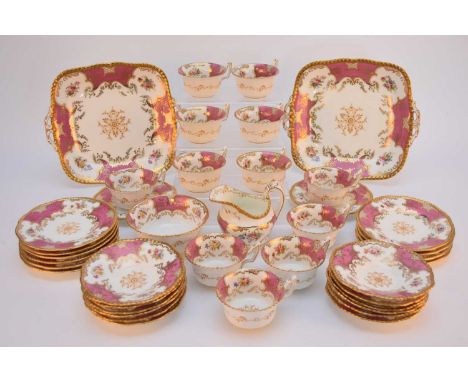 A Coalport pink batwing tea service, circa 1900-10, twelve-person setting comprising twelve tea cups, twelve saucers, twelve 