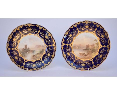 A pair of Coalport dessert or cabinet plates, circa 1891-1919painted by J.H Plant with named views of Dartmouth Castle and Ro