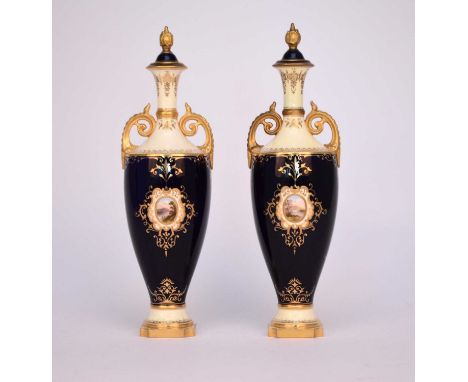 A pair of Coalport vases and covers, circa 1900, of twin-handled form, the dark blue and lemon yellow grounds painted with op