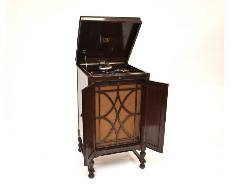 An HMV (His Master’s Voice) model 163 cabinet wind-up gramophoneEnclosed in a mahogany veneered cabinet with lift-up top abov