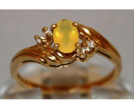 A SMALL DRESS RING set in 9ct gold.