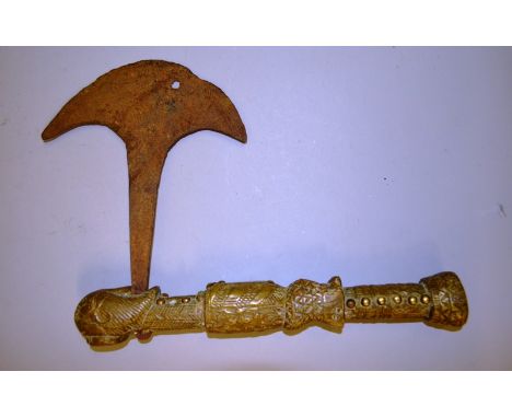 AN EARLY TRIBAL BRASS AND IRON AXE.