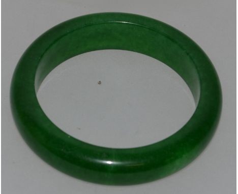 A JADE BANGLE.
