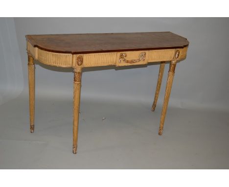A GOOD GEORGE III PAINTED AND GILDED CONSOLE TABLE on pine with crossbanded and faded rosewood top, the frieze with applied g