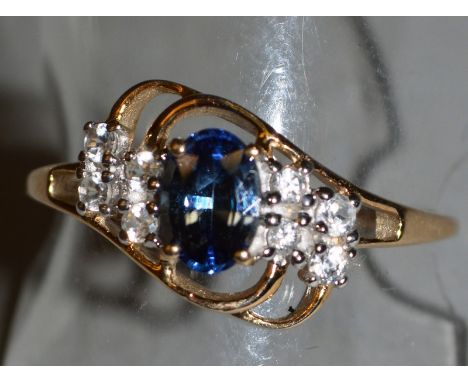 A 9CT GOLD, BLUE STONE AND DIAMOND RING.