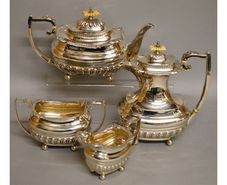 A GOOD GEORGE V FOUR PIECE SILVER TEA SET, teapot, hot water jug, sugar basin and milk jug. Sheffield 1918 Maker: Walker & Ha