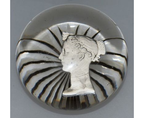 A BACCARAT PORTRAIT PAPERWEIGHT, probably by ANDRIEU of QUEEN VICTORIA with star cut base. 3ins diameter.