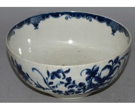A WORCESTER BLUE AND WHITE CIRCULAR BOWL painted with flowers in under-glaze blue Blue crescent mark 6ins diameter.