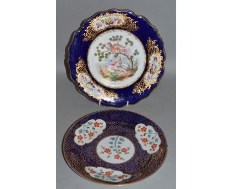 A 19TH CENTURY CHAMBERLAIN WORCESTER PLATE with raised paste gilding on a blue border finely painted with birds and a Chamber