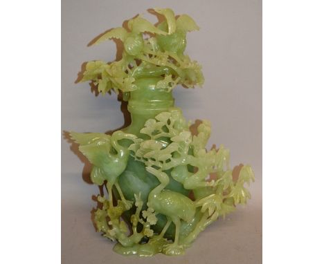 A LARGE CHINESE JADE LIKE VASE AND COVER pierced with cranes, flowers and foliage. 15ins high.