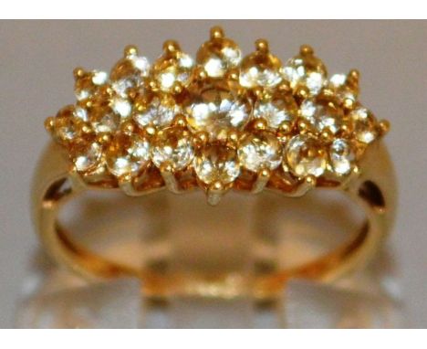 A GOOD CLUSTER DRESS RING set in 9ct gold.