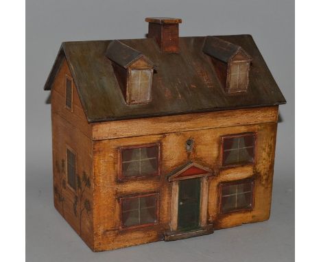 A RARE EARLY 19TH CENTURY PAINTED TEA CADDY IN THE FORM OF A HOUSE with chimney, two dormer windows on the roof which opens t