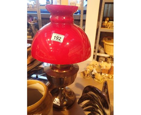 Spirit fired lamp with brass base complete with chimney and red shade H: 60 cm 