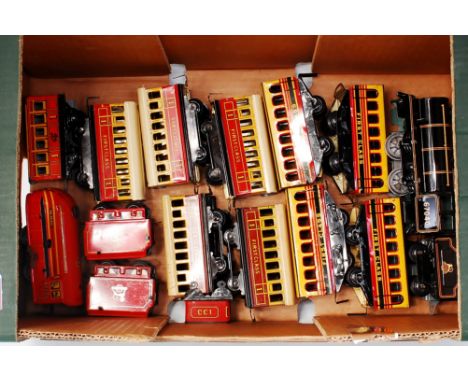 A small tray of mainly Brimtoy coaches including 4x  yellow/red/black First class, 3x yellow/red First class, 2x yellow/brown