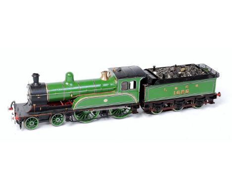 Ex North Eastern Railways 4-4-0 engine in early LNER Darlington green livery No. 1625 with connected 6 wheel tender with skat