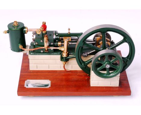 A very well engineered model of The Croft Mill Engine, built by Gordon Barber, finished in dark green and raised on a detaile