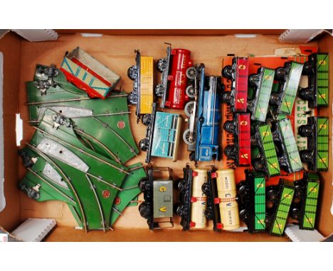 A large tray of mainly Chad Valley rolling stock including 9x green opens, 2x red opens, yellow open, red tanker, blue cattle