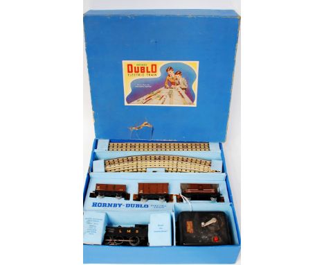 A Hornby Dublo EDG7 tank goods set containing LMS post war tank engine and 3 LMS wagons, track and controller, no instruction