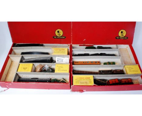 Two Trix Twin Railway red set boxes (BF) containing freelance LNER green No. 465 engine and tender, LMS black 8067 engine and