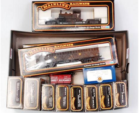 11 boxed, one unboxed Mainline wagons including GW Crocodile wagon with saddle tank  engine load (G-BG) and 1 Bachmann (G-BG)