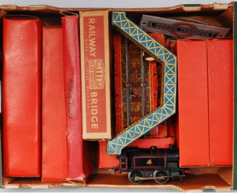 A large tray containing Hornby 1954-60 Type 40 BR black tank loco No. 82011 (F) 1933-41 M footbridge (G), Mettoy railway brid