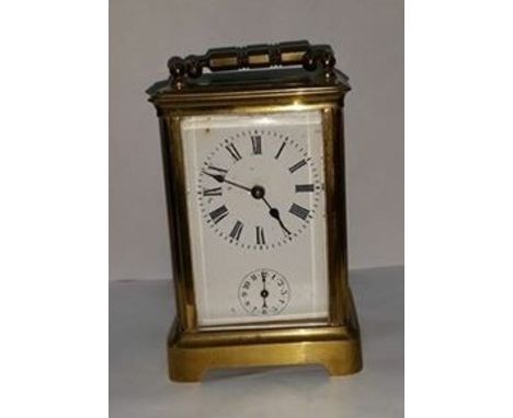 EARLY 20TH CENTURY BRASS CARRIAGE CLOCK
with Roman numerals and secondary hour dial, on bracket feet, 14.5cm high