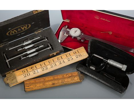 GROUP OF FIVE VINTAGE ENGINEER'S TOOLS
including two vintage wooden folding rules, micromiter, a dial caliper and a tube gaug
