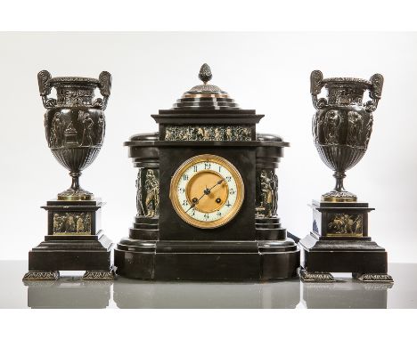 VICTORIAN ARCHITECTURAL BLACK SLATE AND PATINATED METAL CLOCK GARNITURE
the clock with Arabic enamel dial and bronze relief p