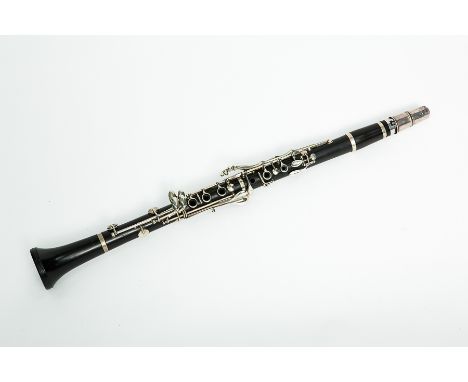ENGLISH EBONY CLARINET
stamped 'Made in London', with its mouthpiece and case, 68cm long
