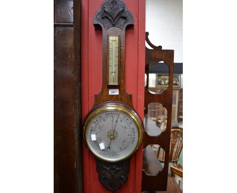 An early 20th century oak wheel barometer, thermometer 
