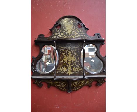 A Victorian rosewood cartouche shaped wall shelf, two serpentine shelves, two kidney shaped mirrors, inlaid with mask, harebe