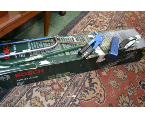 A Bosch hedge trimmer, battery powered; five assorted tools