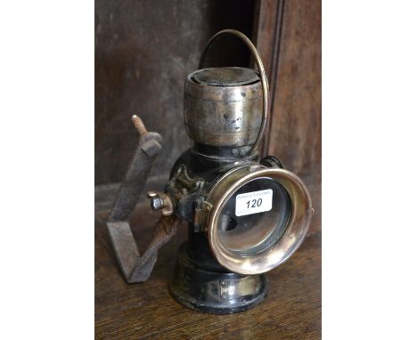 A brass Lucas No 63 King of the Road lamp.