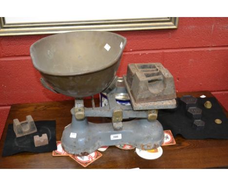 A set of cast iron trade scales and weights