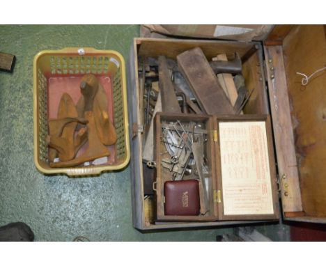 A wooden tool box with a large quantity of engineer's and woodworker's tools to include planes, saws, calipers, spanners etc
