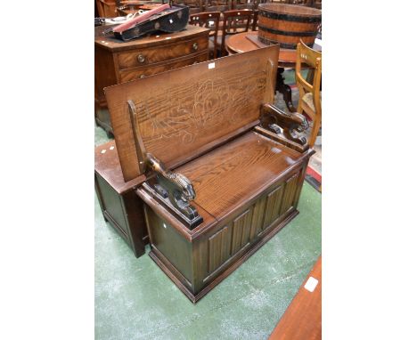 An oak linenfold monk's bench