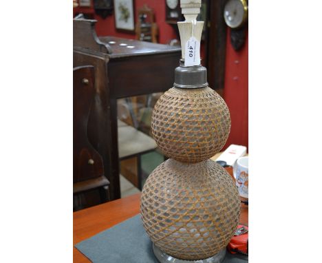 A 19th century double gourd wicker and glass soda siphon, converted to table lamp