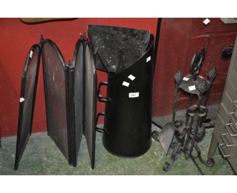 A wrought iron companion set; a fireguard; a four fold fireguard; a coal scuttle; an ash shovel. (5)