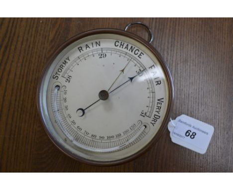 A Victorian brass cased barometer and thermometer