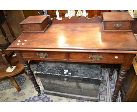 A Victorian mahogany dressing table bass, two short drawers to frieze, turned legs, ceramic casters