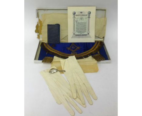 Of Masonic interest, an apron, gloves, booklet and also a silver caddy spoon.