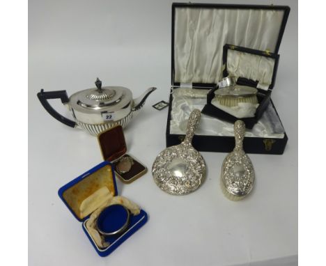 A silver napkin ring, silver back clothes brush, a four piece silver back dressing table set, cased, EP tea pot, bangle and s