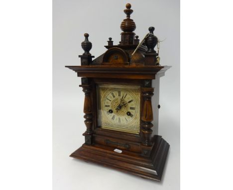 Victorian stained wood mantel clock with eight day chiming movement, height 48cm.